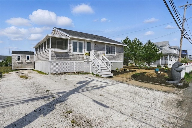 129 Northern Blvd, Newbury, MA 01951 - view of front of house with a sunroom and an outbuilding