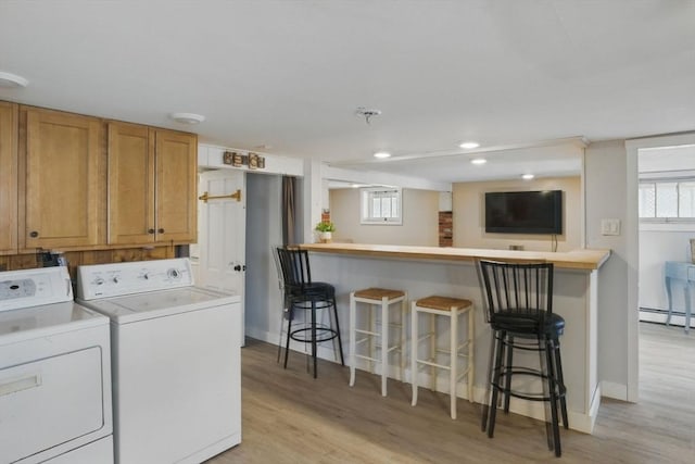 129 Northern Blvd, Newbury, MA 01951 - laundry area featuring independent washer and dryer, light wood finished floors, baseboards, recessed lighting, and a bar