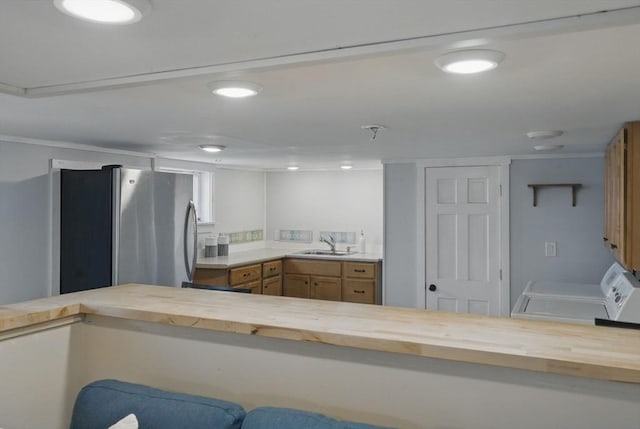 129 Northern Blvd, Newbury, MA 01951 - kitchen featuring butcher block counters, freestanding refrigerator, a sink, brown cabinetry, and recessed lighting