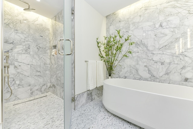 bathroom featuring separate shower and tub