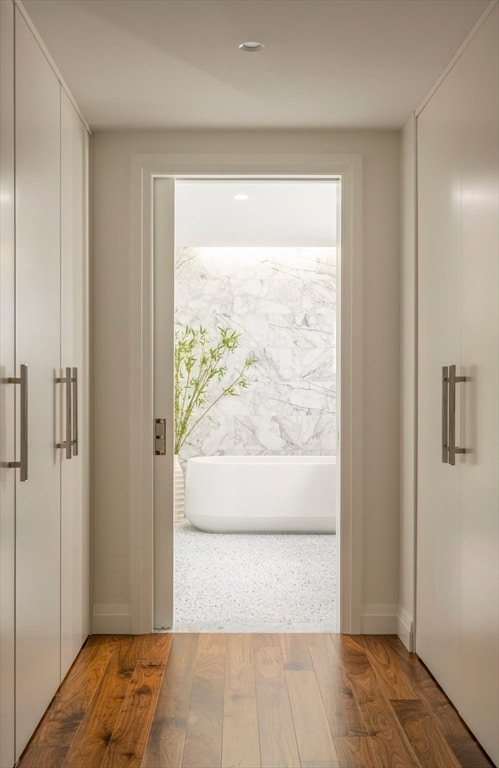 entryway with hardwood / wood-style floors