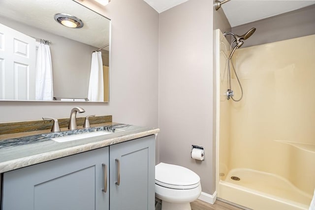 706 Ridgefield Cir Unit A, Clinton, MA 01510 - bathroom featuring vanity, a shower with curtain, and wood finished floors