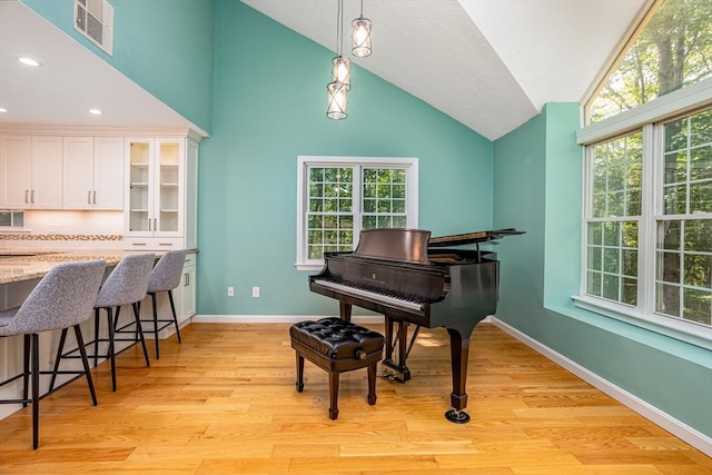 706 Ridgefield Cir Unit A, Clinton, MA 01510 - living area featuring light wood-type flooring, vaulted ceiling, healthy amount of natural light, and recessed lighting
