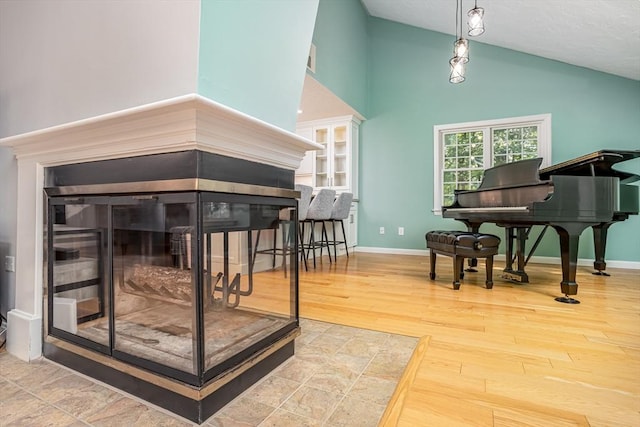 706 Ridgefield Cir Unit A, Clinton, MA 01510 - living area with high vaulted ceiling and wood finished floors