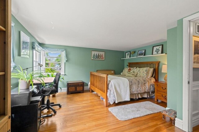 143 Morton St, Winthrop, MA 02152 - bedroom featuring an office area, wood finished floors, and baseboards