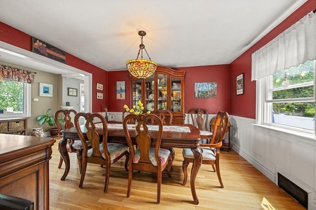 143 Morton St, Winthrop, MA 02152 - dining space featuring plenty of natural light, light wood finished floors, and a wainscoted wall