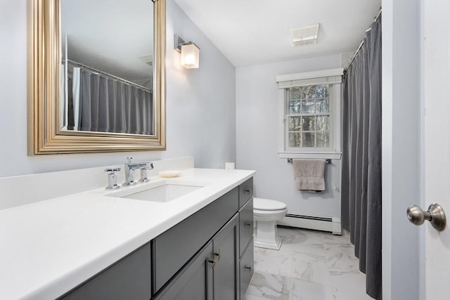 bathroom with baseboard heating, vanity, and toilet