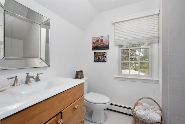 bathroom with a baseboard radiator, vanity, toilet, and vaulted ceiling