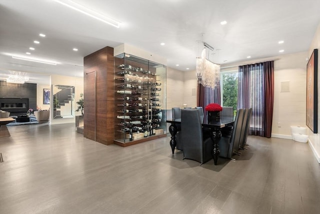 wine cellar featuring an inviting chandelier and hardwood / wood-style flooring