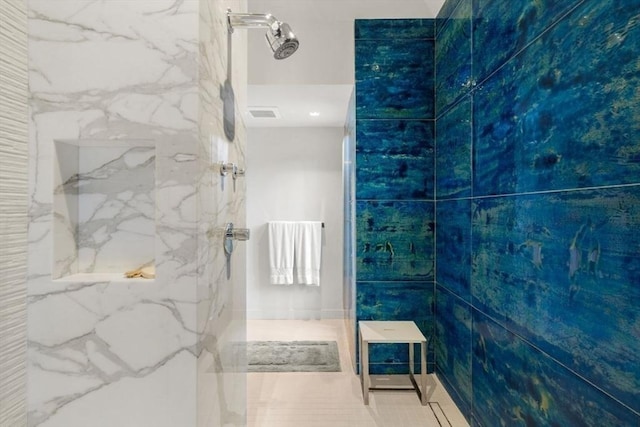 bathroom with walk in shower and tile patterned flooring