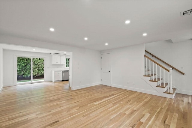 176 Palmer Ave Unit 2, Falmouth, MA 02540 - unfurnished living room with recessed lighting, light wood-style flooring, and stairway