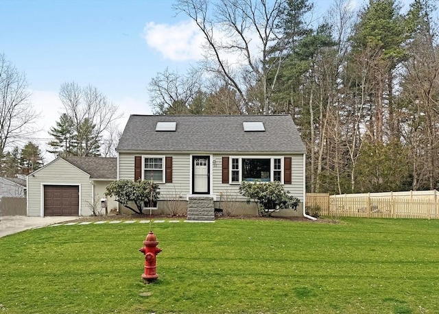 view of front facade with a garage, driveway, a front yard, and fence