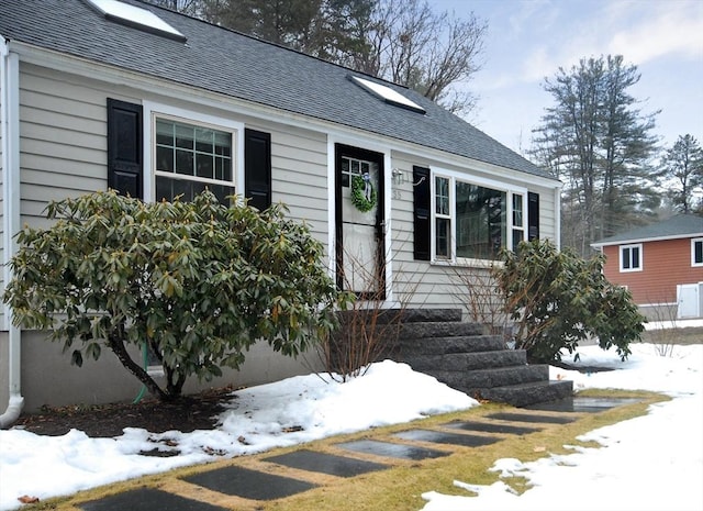 view of front of home with roof with shingles