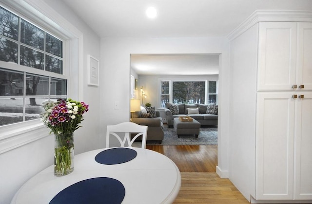 dining space with light wood-style flooring