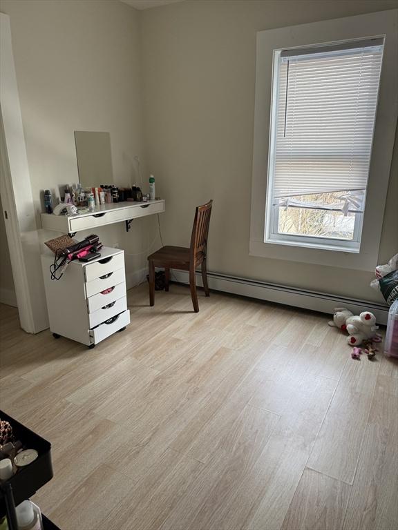 office area featuring light hardwood / wood-style floors and baseboard heating