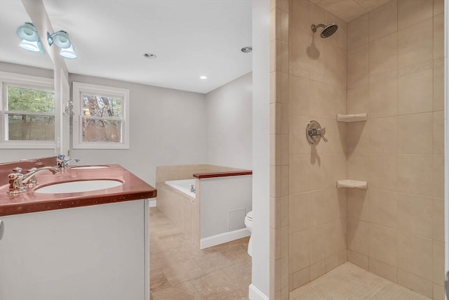 full bathroom featuring a garden tub, a tile shower, and a sink