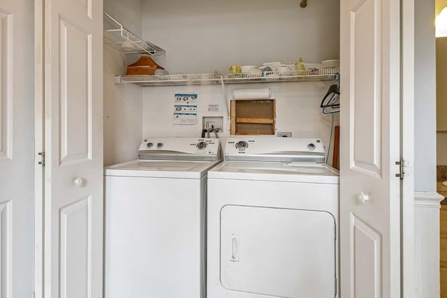 laundry room featuring washing machine and dryer