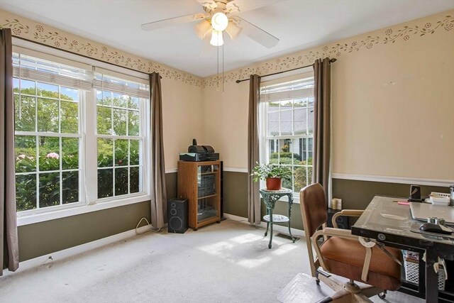 home office with carpet flooring, baseboards, and ceiling fan