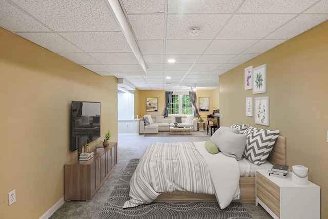 bedroom featuring recessed lighting, carpet, a drop ceiling, and baseboards