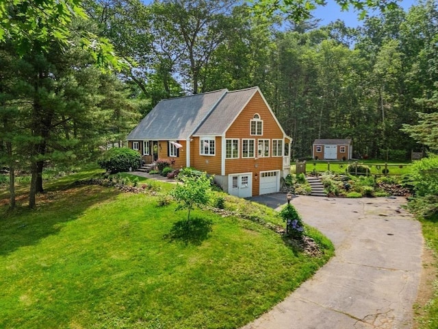 115 Depot, Boxford, MA 01921 - view of front of home with asphalt driveway, a front yard, and an attached garage