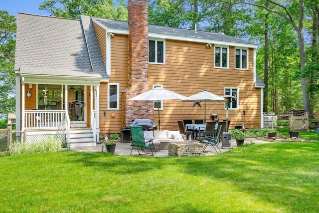 115 Depot, Boxford, MA 01921 - back of house with a chimney, a lawn, roof with shingles, and a patio
