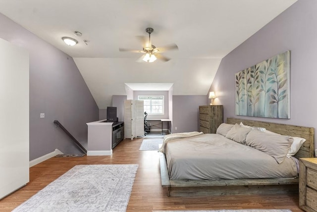 20 Copper Lantern Ln Unit 20, Carver, MA 02330 - bedroom with vaulted ceiling, wood finished floors, baseboards, and ceiling fan