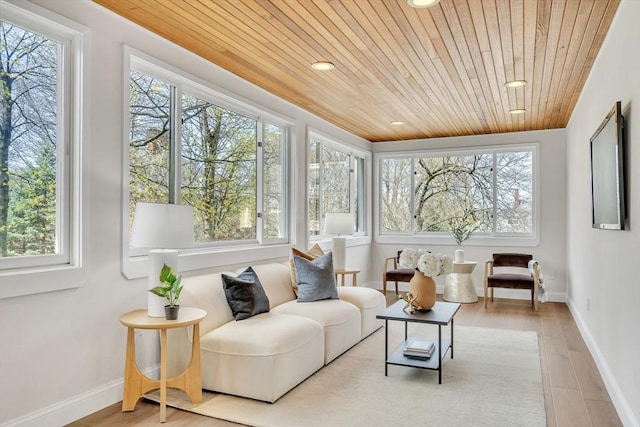 sunroom / solarium with wood ceiling, baseboards, recessed lighting, and wood finished floors