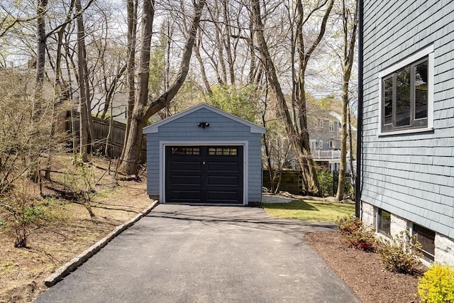 detached garage featuring driveway