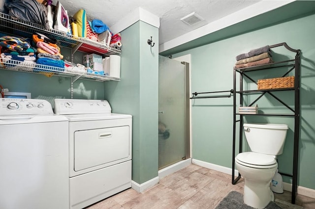6 Cedar Pond Dr, Sturbridge, MA 01566 - washroom featuring separate washer and dryer and light wood-type flooring
