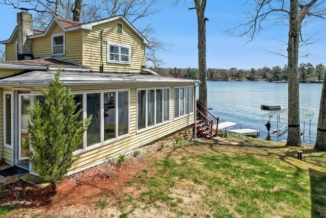 6 Cedar Pond Dr, Sturbridge, MA 01566 - view of home's exterior featuring a water view, a chimney, and a lawn