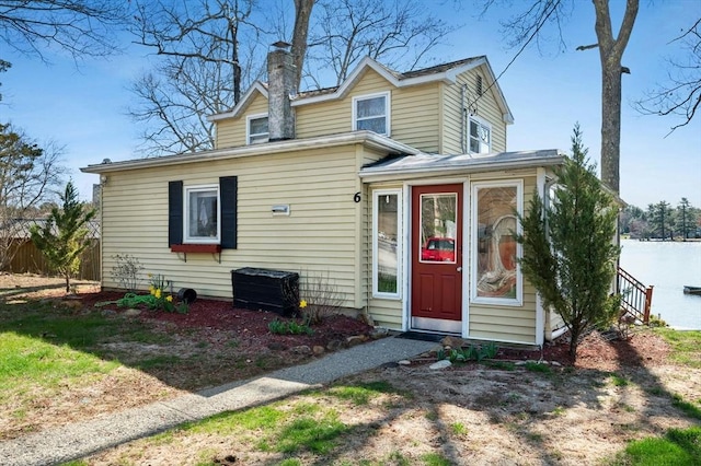 6 Cedar Pond Dr, Sturbridge, MA 01566 - view of front of house with a chimney