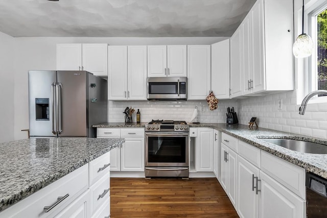 39 High, Haverhill, MA 01832 - kitchen featuring stainless steel appliances, light stone counters, white cabinetry, dark wood-type flooring, and decorative backsplash