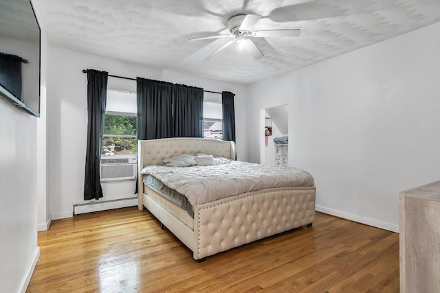 39 High, Haverhill, MA 01832 - bedroom with a baseboard radiator, light wood-style flooring, ceiling fan, and cooling unit