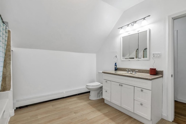 39 High, Haverhill, MA 01832 - bathroom with a baseboard radiator, vaulted ceiling, vanity, wood finished floors, and a bathtub