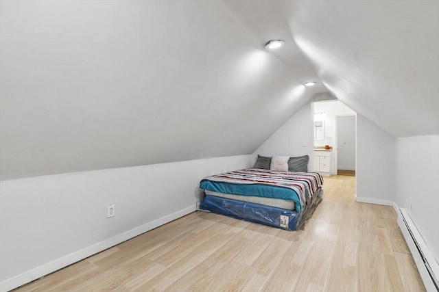 39 High, Haverhill, MA 01832 - bedroom with a baseboard radiator, lofted ceiling, and wood finished floors