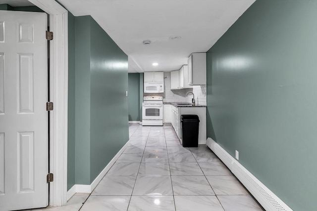 39 High, Haverhill, MA 01832 - kitchen featuring white appliances, a baseboard radiator, light marble finish flooring, white cabinets, and decorative backsplash