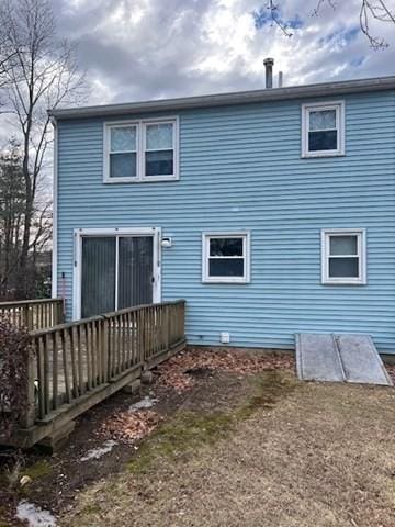 rear view of house with a wooden deck