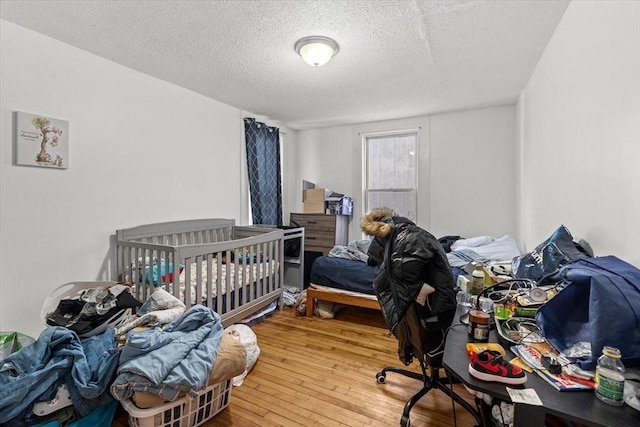 15 Russell St, Worcester, MA 01609 - bedroom with hardwood / wood-style floors and a textured ceiling