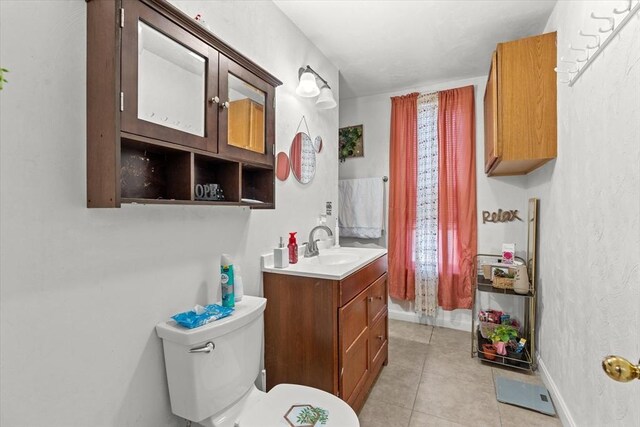 15 Russell St, Worcester, MA 01609 - bathroom featuring vanity, tile patterned flooring, toilet, and baseboards