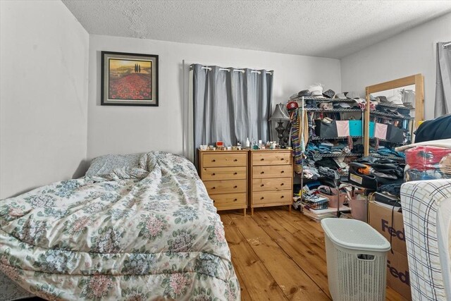15 Russell St, Worcester, MA 01609 - bedroom featuring hardwood / wood-style flooring and a textured ceiling