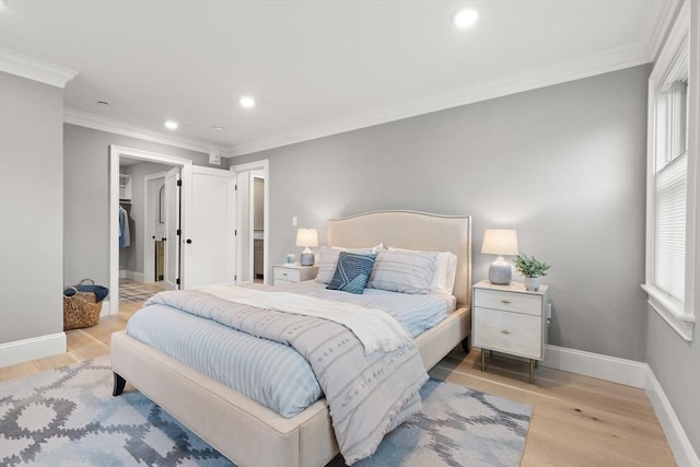 36 Broadway Unit 0, Rockport, MA 01966 - bedroom featuring light wood-type flooring, recessed lighting, ornamental molding, and a walk in closet