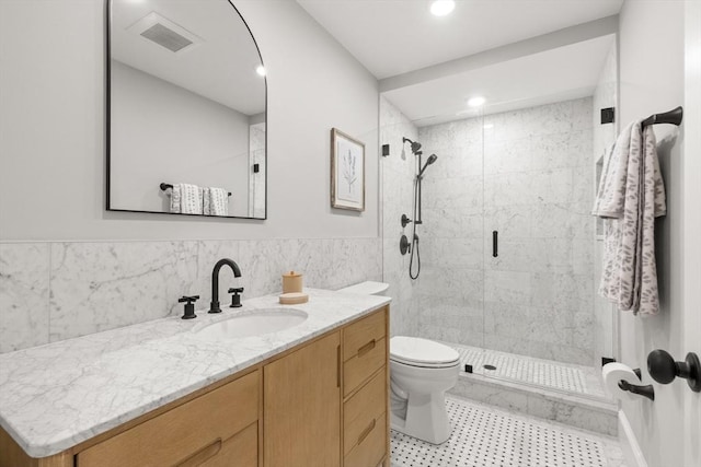 36 Broadway Unit 0, Rockport, MA 01966 - full bath featuring vanity, a stall shower, tile walls, recessed lighting, and a wainscoted wall