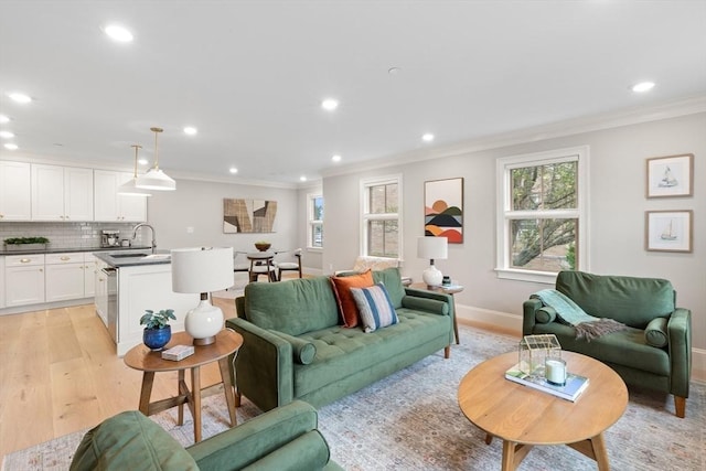 36 Broadway Unit 0, Rockport, MA 01966 - living room featuring light wood-style floors, crown molding, and recessed lighting