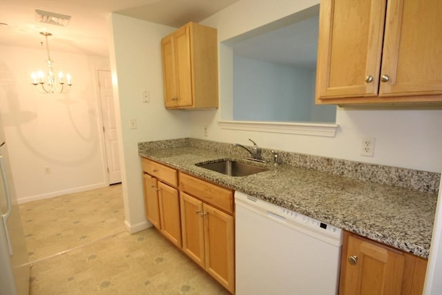 110 Dillingham Ave Unit 212, Falmouth, MA 02540 - kitchen featuring white dishwasher, a chandelier, light stone countertops, hanging light fixtures, and light flooring