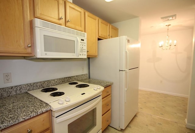110 Dillingham Ave Unit 212, Falmouth, MA 02540 - kitchen with white appliances, light brown cabinets, a chandelier, hanging light fixtures, and light stone countertops