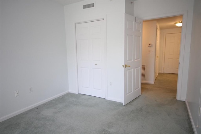 110 Dillingham Ave Unit 212, Falmouth, MA 02540 - unfurnished bedroom featuring carpet floors and a closet
