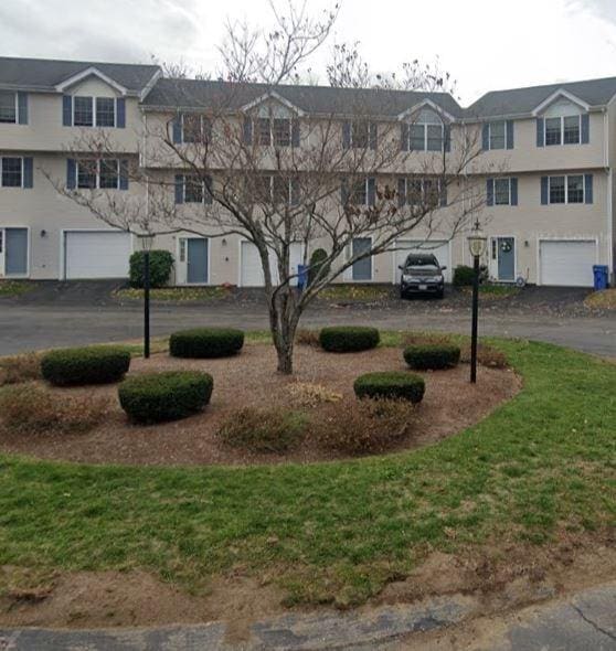 exterior space featuring driveway and an attached garage