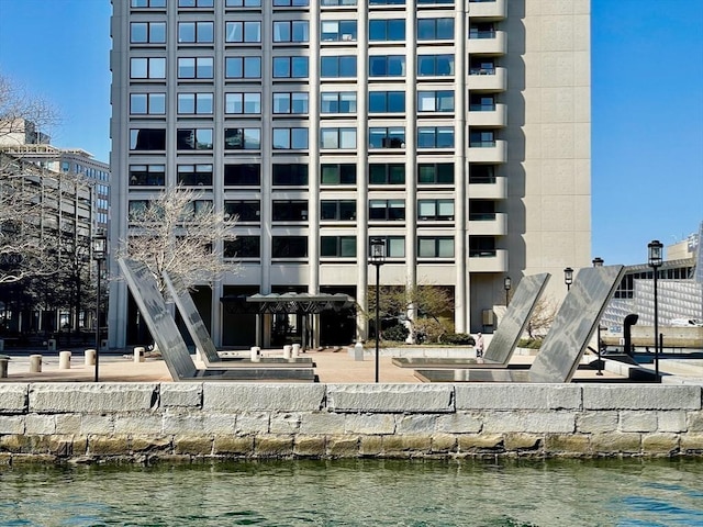 view of building exterior with a water view