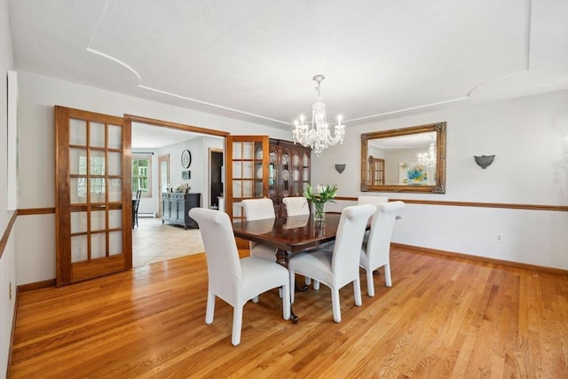 5 Red Tail Run, Canton, MA 02021 - dining area with a chandelier, french doors, light wood finished floors, and baseboards