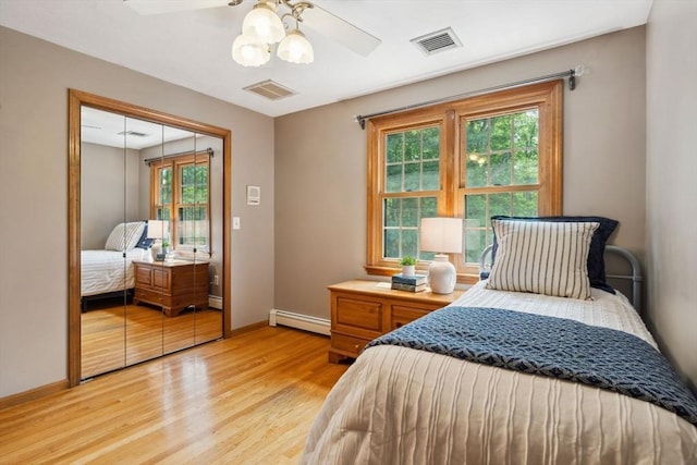 5 Red Tail Run, Canton, MA 02021 - bedroom featuring baseboard heating, light wood finished floors, baseboards, and a ceiling fan